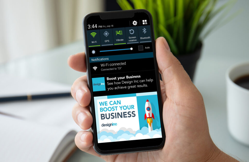 A mobile phone displaying digital marketing notification and business growth concepts, representing online marketing and digital solutions